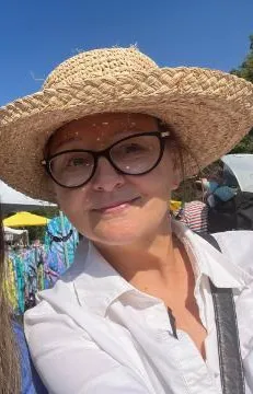 Kim Hornsby, hat, glasses, white shirt